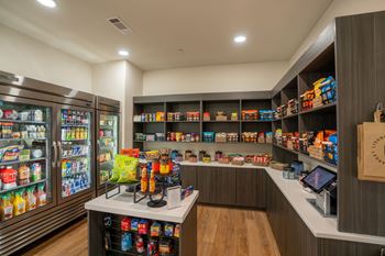 a convenience store with a large variety of food and drinks on the counter